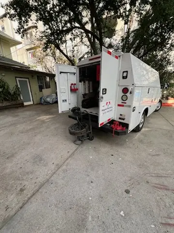 Magnet Plumbing service vehicle on-site for Water Heater Repair in Houston